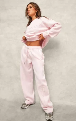 PRETTYLITTLETHING Baby Pink Embossed Graphic Straight Leg Sweatpant