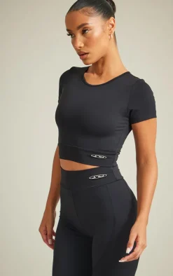PRETTYLITTLETHING Black Sport Metal Badge Sculpt Short Sleeve Crop Top