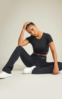 PRETTYLITTLETHING Black Sport Metal Badge Sculpt Short Sleeve Crop Top