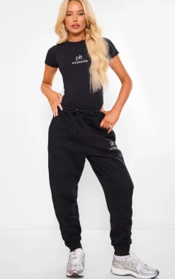 PRETTYLITTLETHING Black Silver Logo Short Sleeved Bodysuit