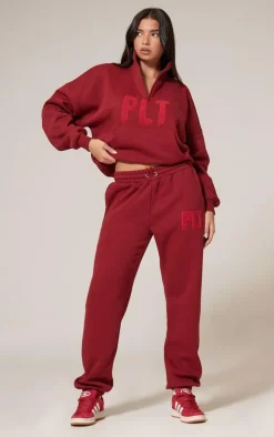 PRETTYLITTLETHING Dark Red Borg Applique Quarter Zip Sweatshirt