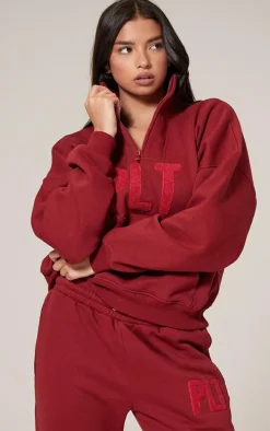 PRETTYLITTLETHING Dark Red Borg Applique Quarter Zip Sweatshirt