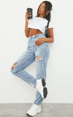 PRETTYLITTLETHING Light Blue Wash Open Knee Ripped Hem Mom Jeans