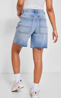 PRETTYLITTLETHING Mid Blue Wash Raw Hem Longline Loose Fit Denim Shorts