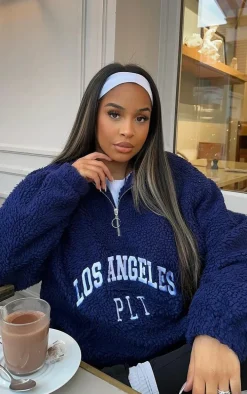 PRETTYLITTLETHING Navy Graphic Front Teddy Jacket