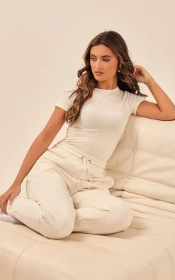 PRETTYLITTLETHING Off White Logo Short Sleeved Bodysuit