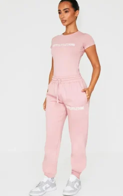 PRETTYLITTLETHING Petite Light Pink Logo Detail Short Sleeve Bodysuit