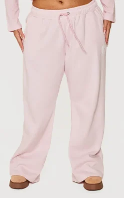 PRETTYLITTLETHING Plus Baby Pink Printed Wide Leg Sweatpants