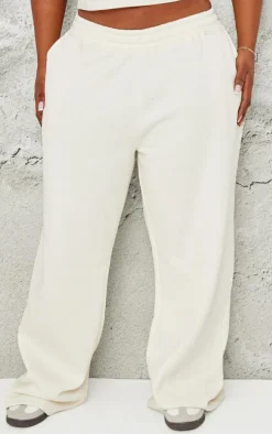 PRETTYLITTLETHING Plus Cream Contrast Embroidery Low Rise Wide Leg Sweatpants