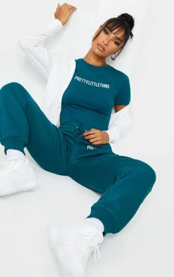 PRETTYLITTLETHING Teal Logo Short Sleeved Bodysuit
