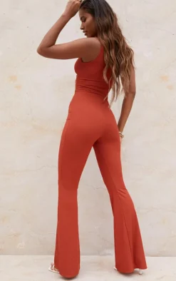 Rust Rib Twist Detail Plunge Flared Jumpsuit